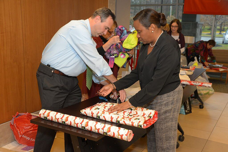 Santa’s Helpers Wrapping Party attendees Sedrick and Tonjal Photo 2